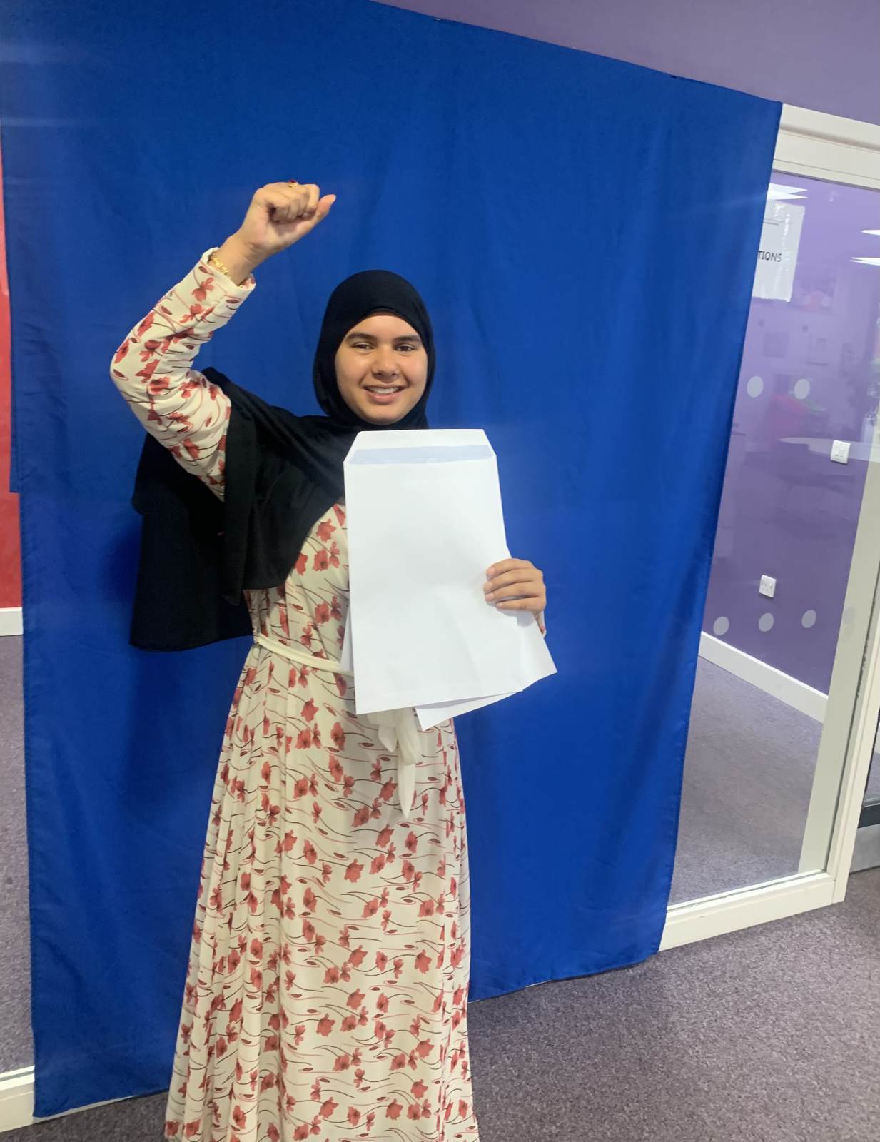 Student celebrating Level 3 success